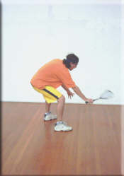 Keep the racket horizontal and bend the knees